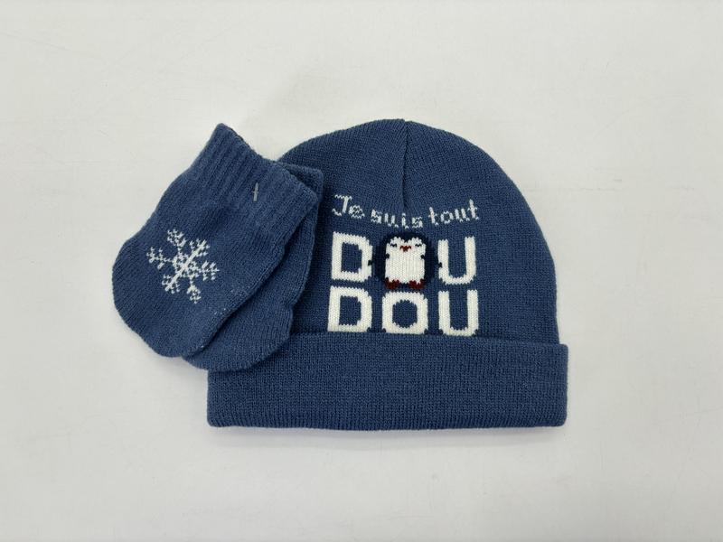 Blue knit baby hat and mittens set with 'Je suis tout Dou Dou' penguin intarsia design and snowflake motif