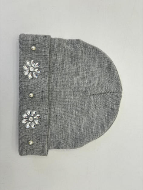 Grey marl knit beanie hat with folded cuff decorated with crystal flower appliques and pearl studs on white background