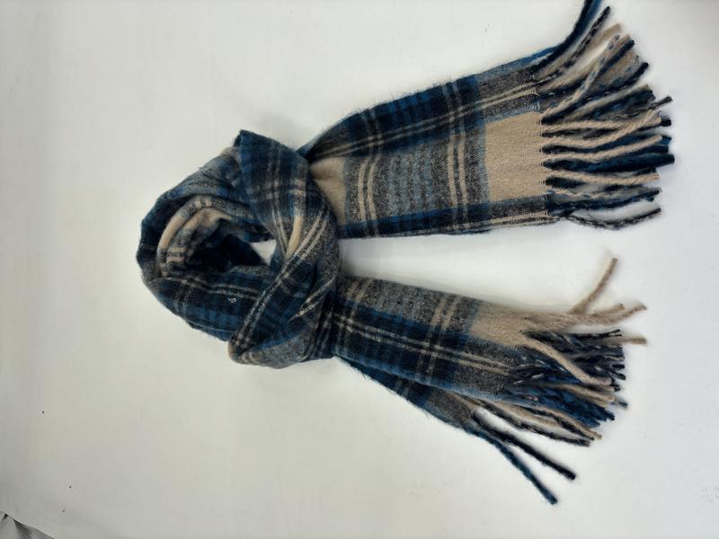 Soft blue, beige and grey tartan plaid scarf with fringe ends, loosely knotted on white background