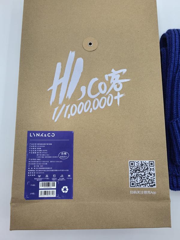 Navy blue chunky knit wool scarf and beanie hat set in branded kraft paper envelope packaging with product label