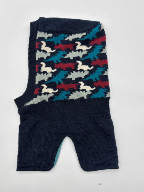 Knitted sleeveless dog sweater in navy blue with teal, burgundy, white abstract bird intarsia pattern, laid flat