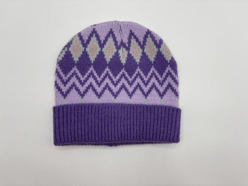 Purple and lavender knit beanie hat with argyle diamond and chevron fair isle pattern and ribbed cuff