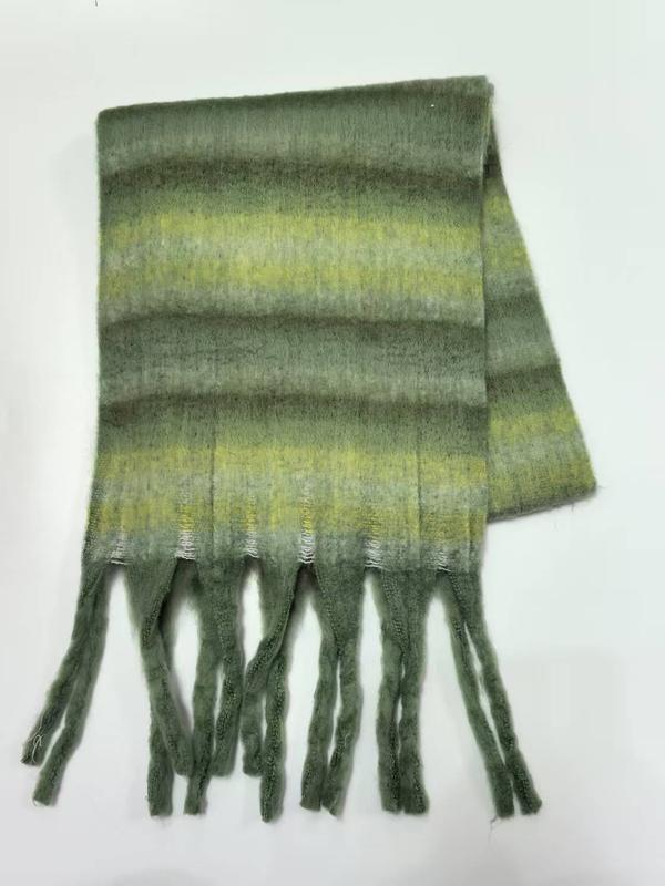 Folded green and yellow striped soft mohair scarf with twisted fringe tassels on white background