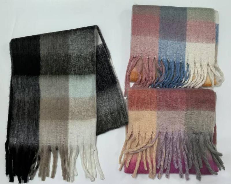 Three plaid check scarves with fringe: dark grey-black with mint, and two pink-blue-mustard multicolor winter wraps