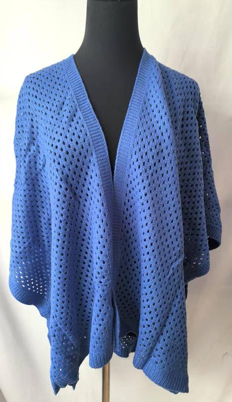 Blue open-knit cocoon cardigan wrap with eyelet pattern displayed on mannequin, featuring wide sleeves and open front