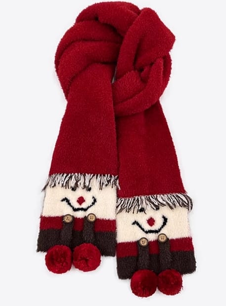 Red fluffy winter scarf with snowman face ends featuring black button eyes, smile embroidery, striped body, and red pom-pom accents