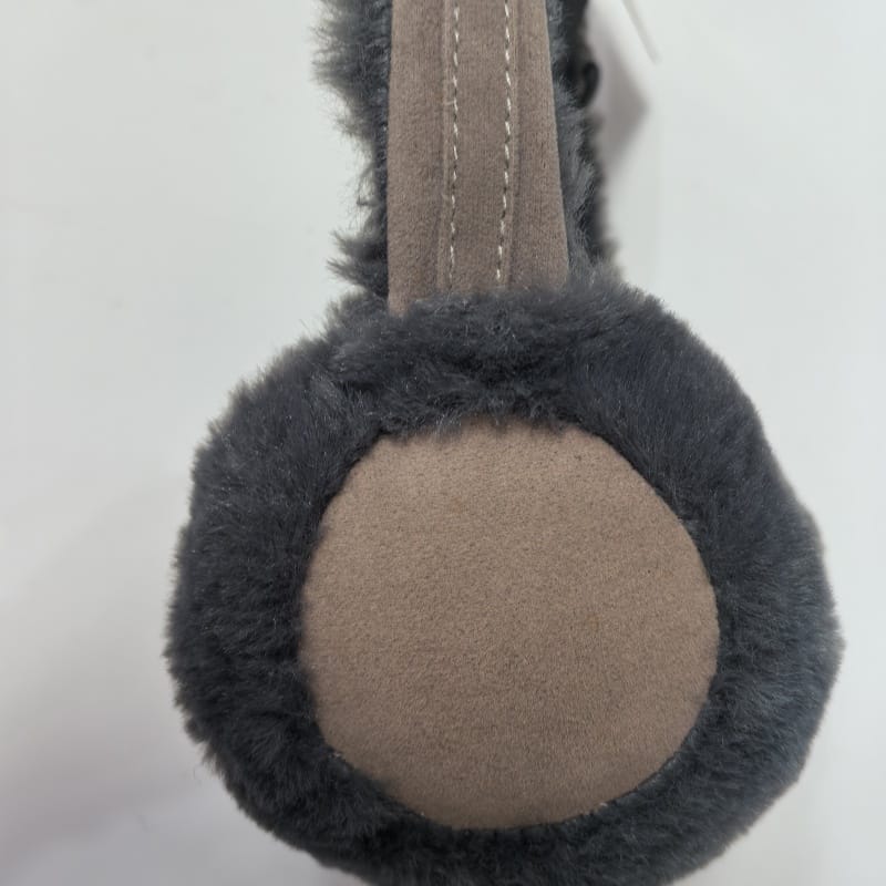 Blue fuzzy plush earmuffs shaped like a cute animal face with red pompom antennae and cream accents on white background