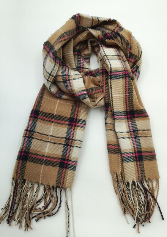 Camel tan tartan plaid scarf with pink black check pattern and twisted fringe ends, coiled on white background