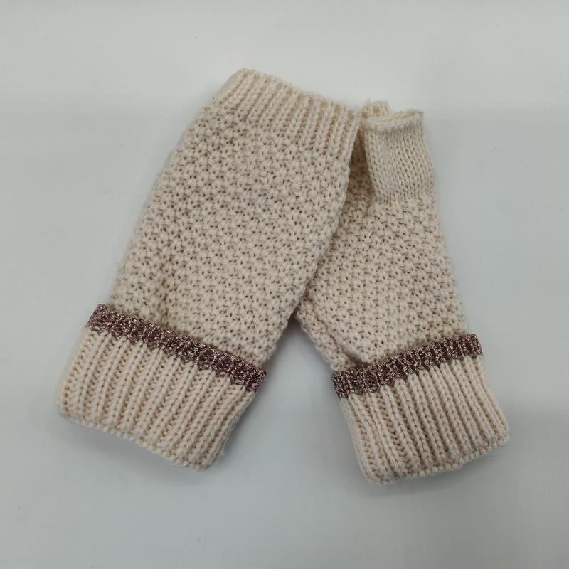 Pair of cream chunky knit fingerless gloves with ribbed cuffs and rose gold metallic trim accent band