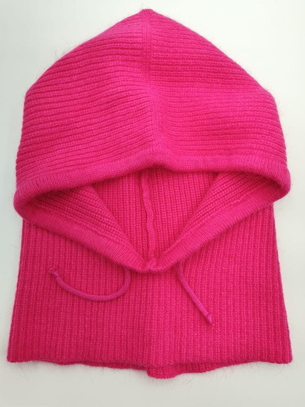 Hot pink ribbed knit balaclava face mask with drawstring ties, laid flat on white background