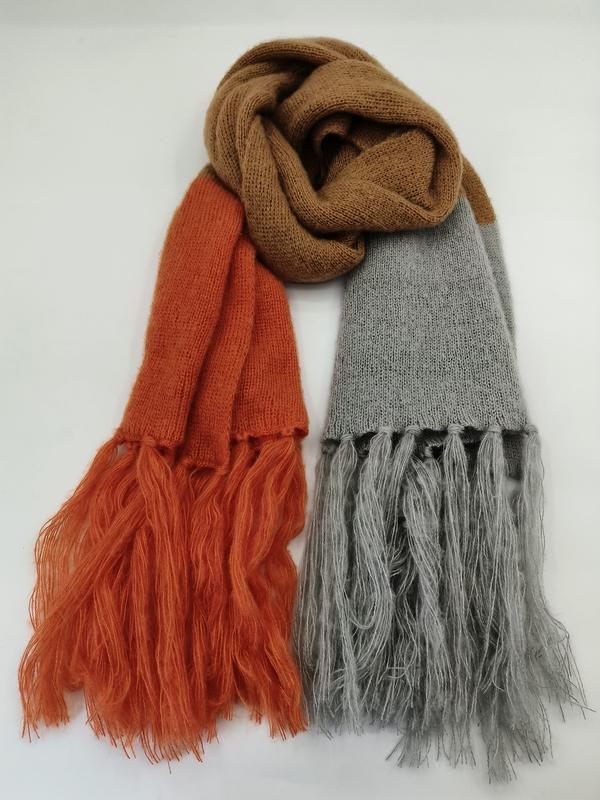 Color block knitted scarf with long fringe ends in rust orange, light grey, and camel brown tones