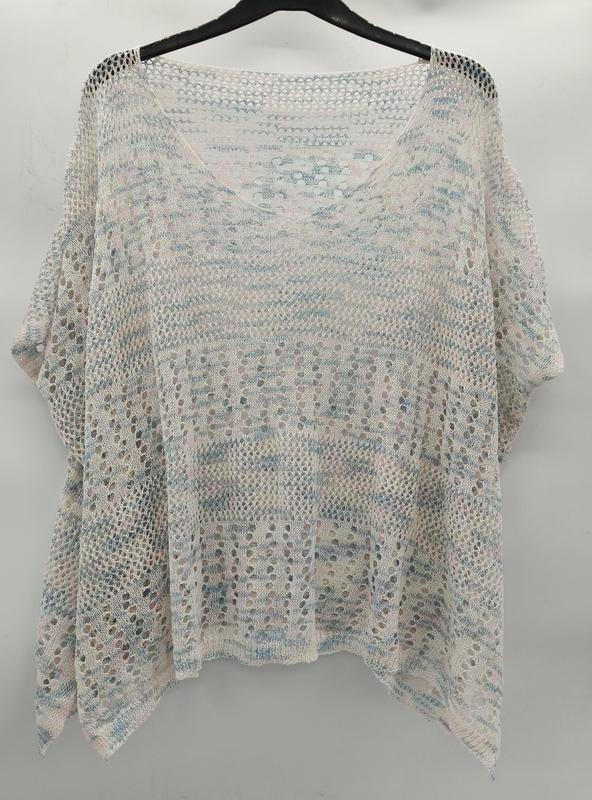 Loose open-knit crochet top in white with blue and pink stripes, batwing sleeves, hanging on black hanger