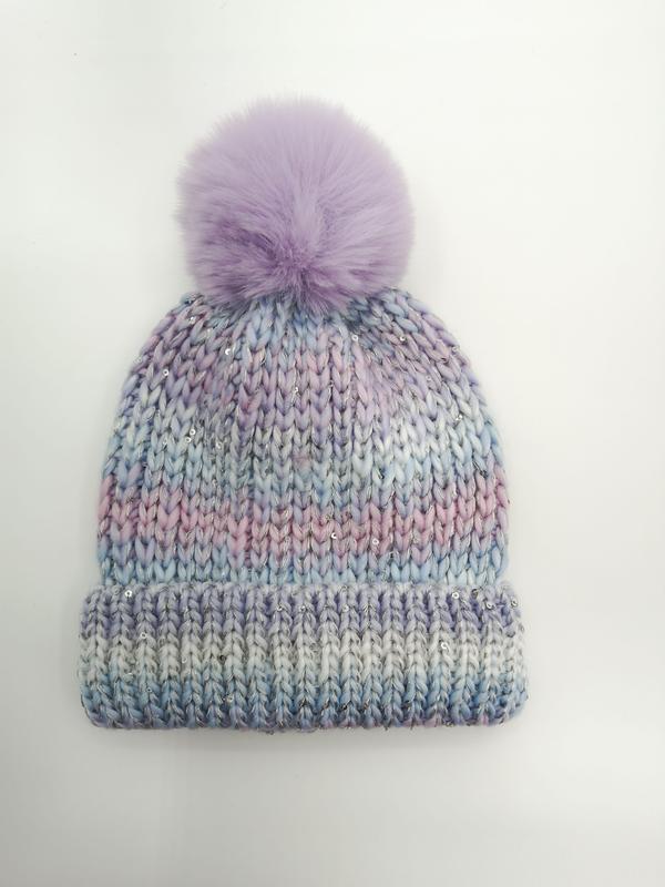 Chunky knit beanie hat in pastel purple blue and pink ombre with silver sequins and lavender faux fur pom-pom on white background