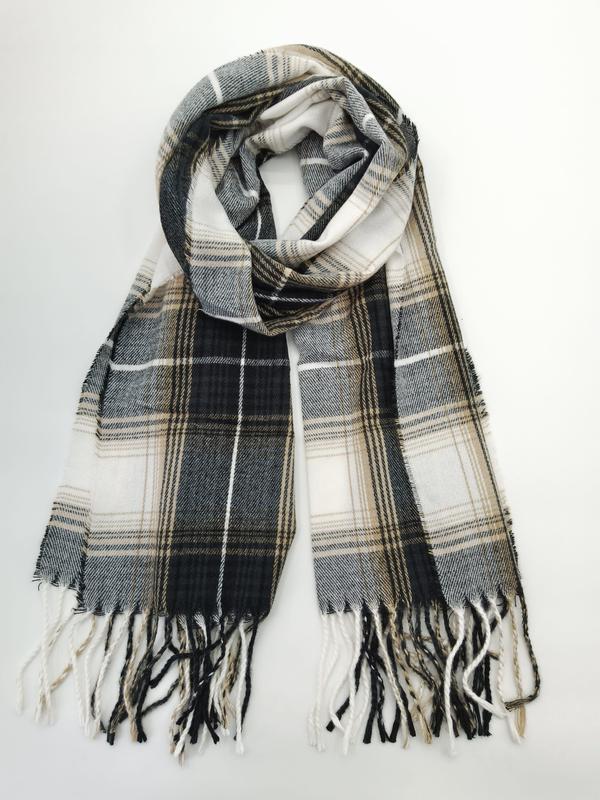Folded black, white, and tan tartan plaid scarf with twisted fringe ends on white background