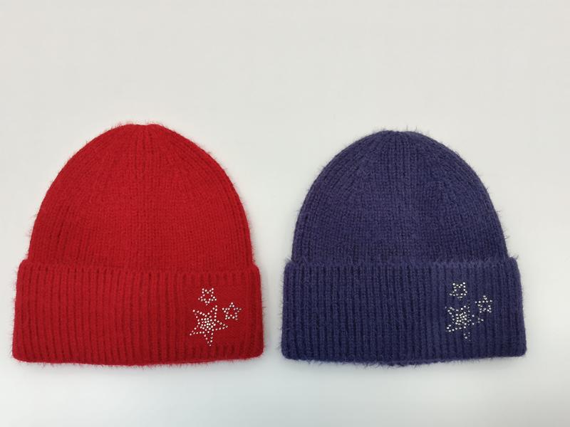 Two fuzzy ribbed knit beanies in red and purple, each decorated with silver rhinestone double-star embellishment on the cuff
