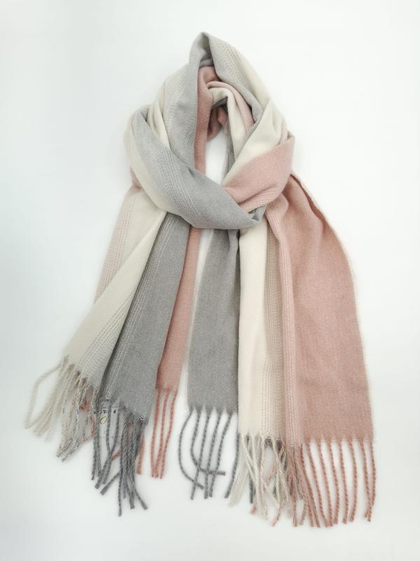 Soft oversized color block scarf in blush pink, light gray, and cream with fringe tassels, loosely knotted on white background