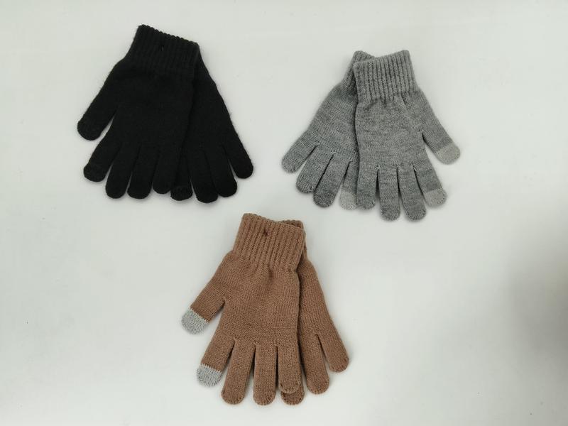 Three pairs of knit winter gloves in black, gray, and tan with touchscreen-compatible fingertips laid flat on white background
