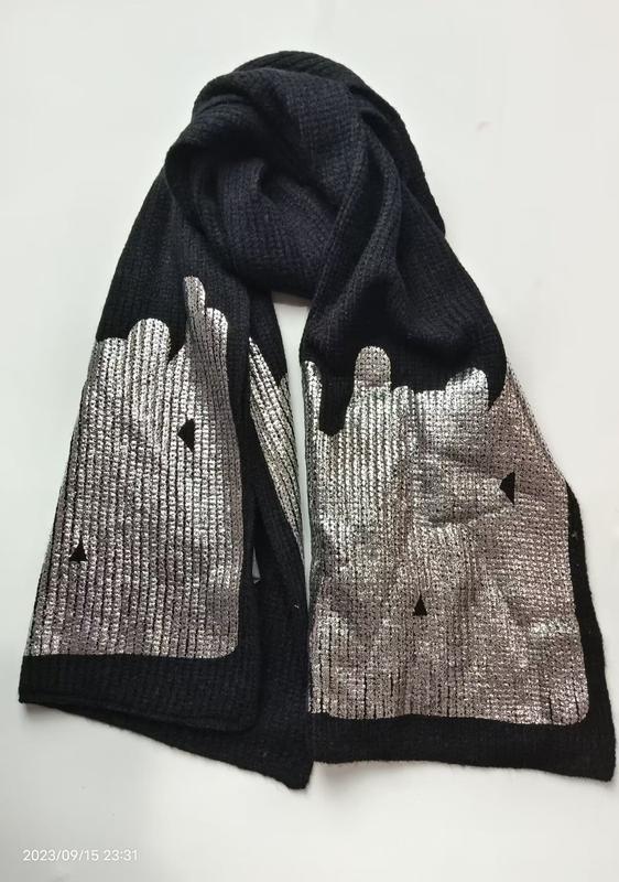 Black ribbed knit winter scarf with shiny silver metallic foil city skyline and drip pattern on both ends
