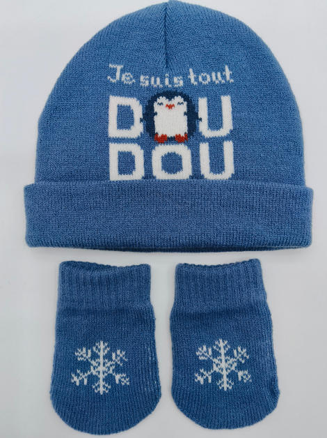 Blue knitted baby hat and mittens set with penguin graphic and snowflake motif on light background