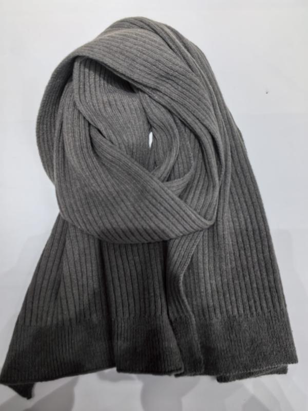 Heather gray ribbed knit winter scarf loosely coiled and displayed against a white background