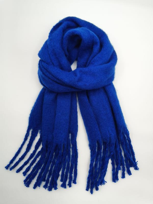 Royal blue soft brushed mohair-style scarf looped and displayed flat with long twisted fringe ends on white background