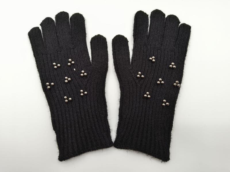 Pair of black ribbed knit winter gloves adorned with small silver metallic stud clusters on the back of the hand
