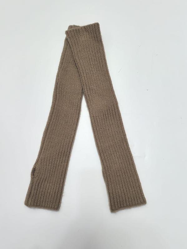 Pair of long ribbed knit fingerless arm warmers in camel tan color laid flat on white background